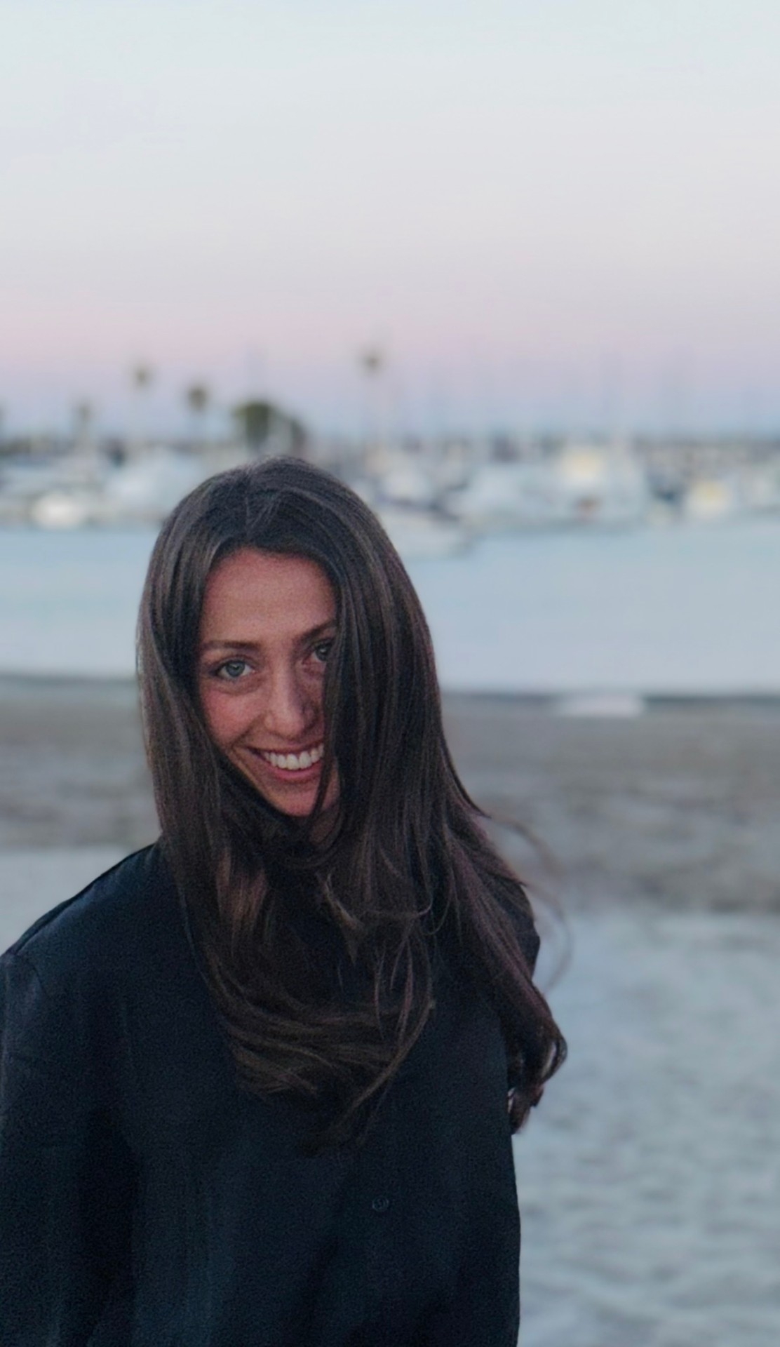 Talia at the harbor at sunset